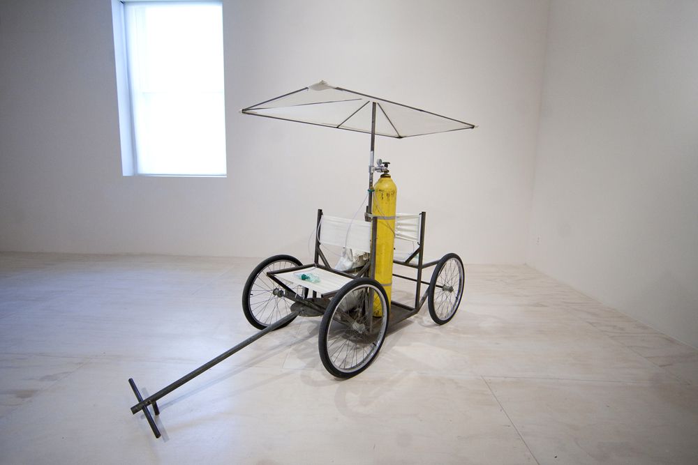 Gordon Matta-Clark's classic <a href="http://tacticaldesign.mit.edu/archives/73">"Fresh Air Cart"</a> consists of "a wheelchair like cart with two oxygen tanks that doled out fresh air to passerbys in the streets of New York City" in 1972. <br/>